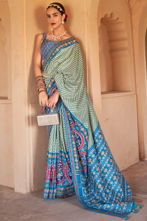 Art Silk Fabric Cyan Color Riveting Printed Patola Saree